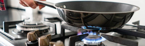 Pan on a lit gas burner on a stove