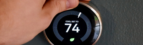 Hand adjusting smart thermostat
