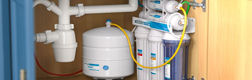 Water filters and garbage disposal tank under a sink