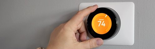 Hand adjusting smart thermostat