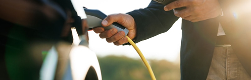 Person charging an EV