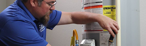 Stan's employee servicing a water heater