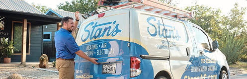 Stan's HVAC employee opening the back of their branded service van