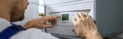 man examining water heater