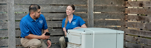 Stan's employees checking a generator