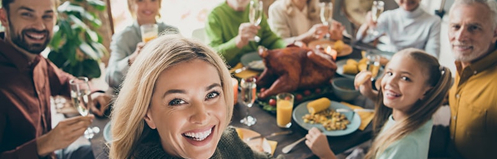 Happy family gathered for a Thanksgiving meal