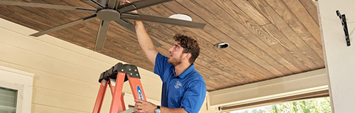Stan's employee inspecting a ceiling fan