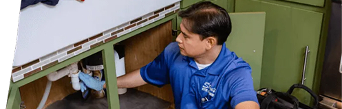 Stan's employee fixing a sink drain
