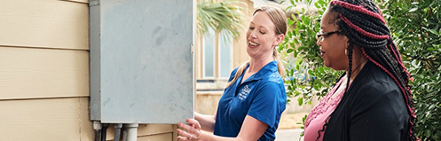 Stan's employee showing a woman tips on her breaker panel