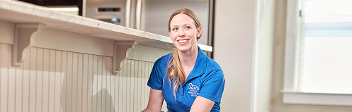 Stan's woman employee smiling