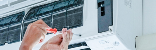 Technician repairing a ductless unit